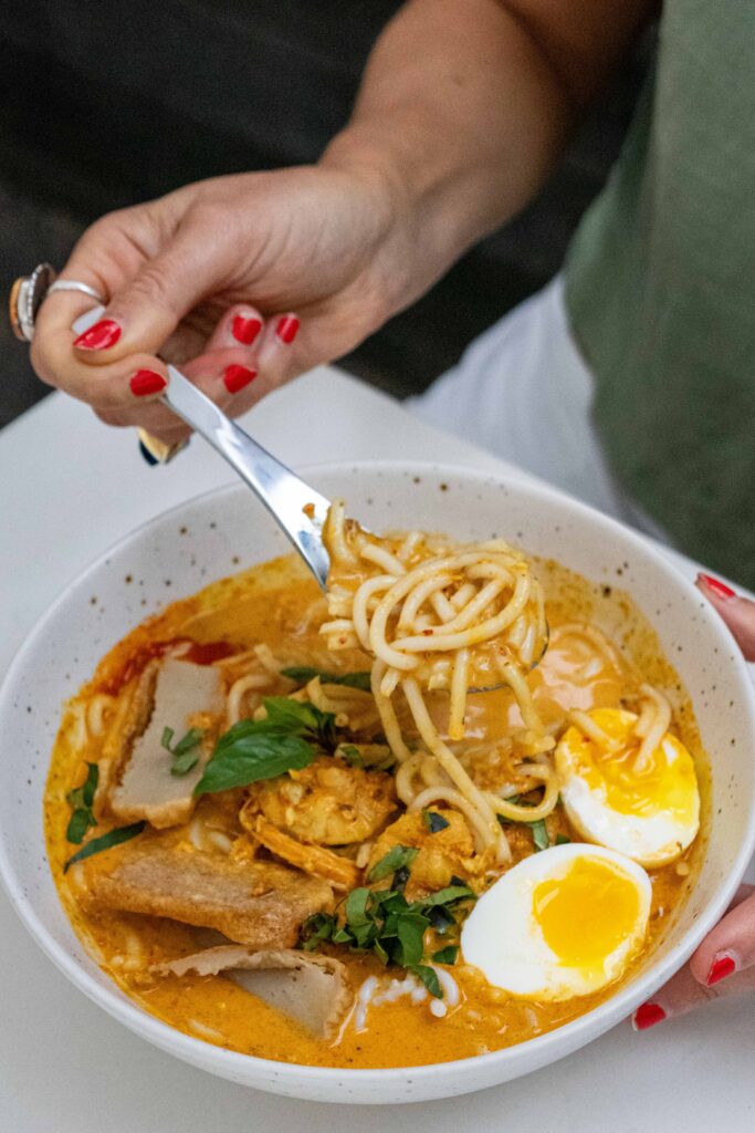 Gati's mushroom congee that's simmered with shitake, oyster mushrooms and ginger and served with soft boiled eggs and chili crisp.