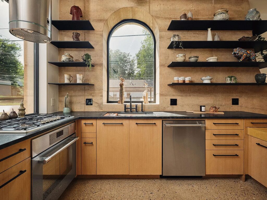 Designed by Davey McEathron Architecture and built by Rabb Construction, this Holly home features curved accents, bold concrete walls, and vibrant interiors.