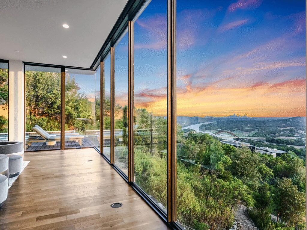 The 5-bedroom, 5.5-bath home spans 5,780 square feet and includes a rooftop living area, outdoor kitchen and a guest suite separated by a grassy courtyard.