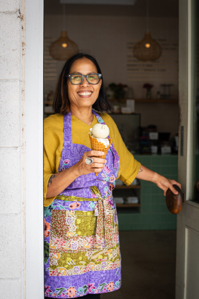 Chef Jam Sanitchat holds an ice cream cone at her vegan ice cream and dessert shop, Gati, in East Austin.