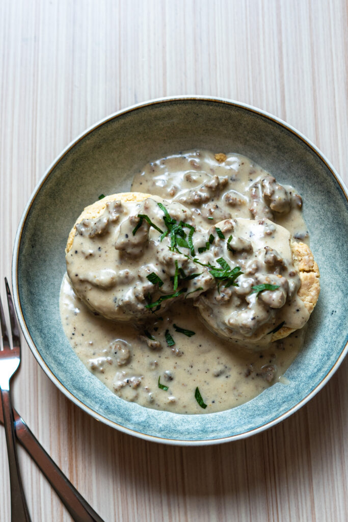 Gati's vegan biscuits with a choice of pork sausage or mushroom gravy.