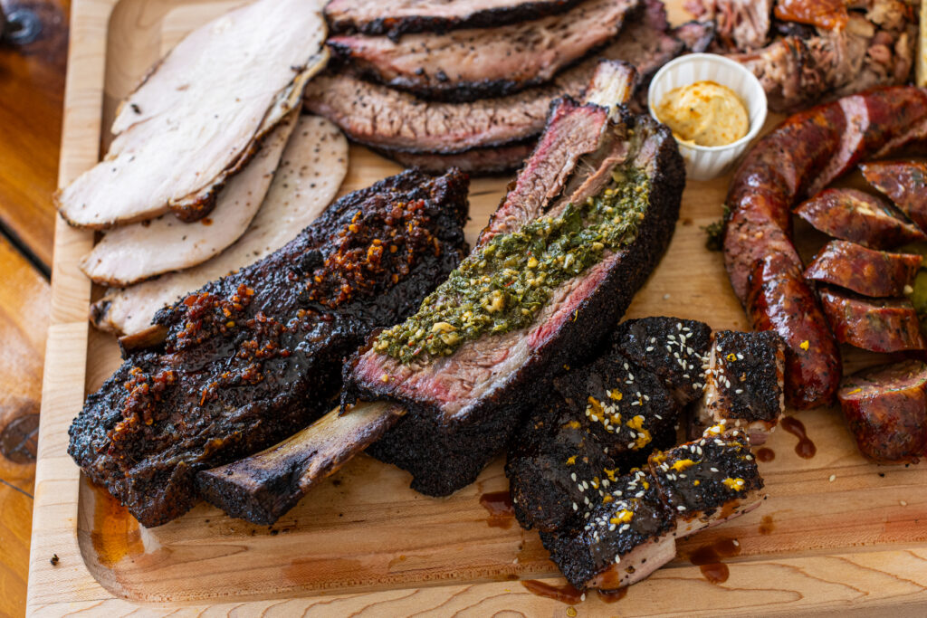 The bacon rib, dino rib and Korean pork belly are among the offerings at Waylon J’s Barbecue.