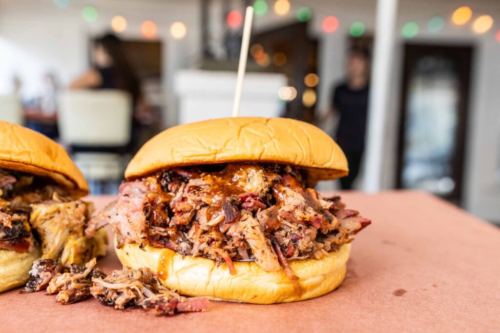 Waylon J’s Classic Chopped sandwich, made with smoked brisket, pickles, onions and classic barbecue sauce on a toasted bun.