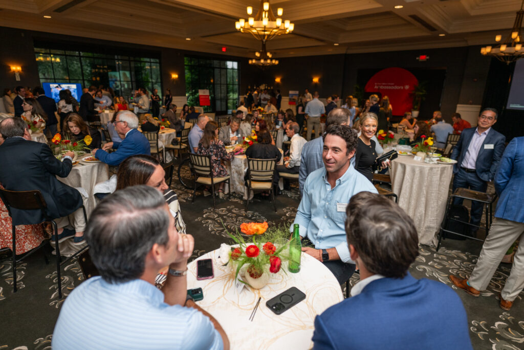 Crowd learning about Ambassadors for Texas Children’s Hospital at Austin Country Club