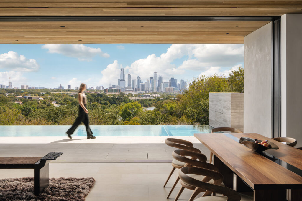 Designed by Miró Rivera Architects, the rooftop pool appears to float above the canopy, offering uninterrupted views of downtown Austin. (Photo by Chase Daniel)