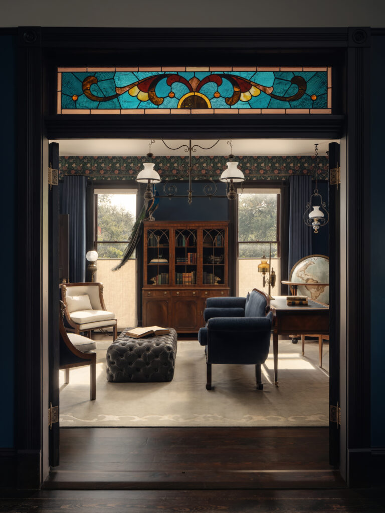 A historic parlor framed by stained glass. (Photo by Chase Daniel)