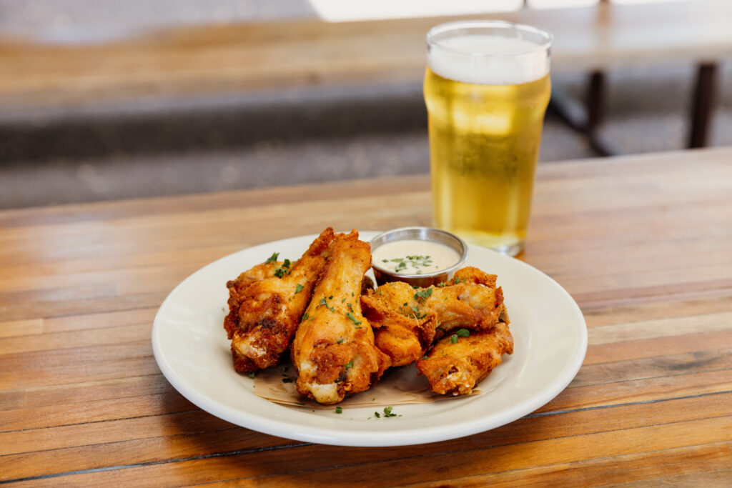 Wings and beer from Easy Tiger. (Photo by Justin Cook)