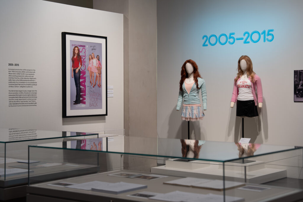 Costumes for Cady Heron and Regina George, played by Lindsay Lohan and Rachel McAdams in the film "Mean Girls," written by Tina Fey and produced by Lorne Michaels.