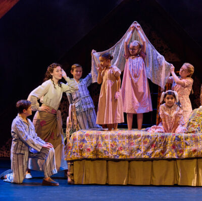 (left, standing) Cayleigh Capaldi (Maria Rainer) with the von Trapp Children (l to r) Eli Vander Griend (Friedrich), Benjamin Stasiek (Kurt), Luciana VanDette (Gretl), Hadalie Mac (Brigitta), Ruby Caramore (Marta), Ava Davis (Louisa), Ariana Ferch (Liesl) in The Sound of Music. (Photo by Jeremy Daniel)