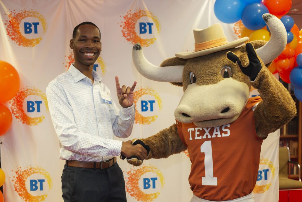 Breakthrough alumnus Jeremiah Thompson with UT Austin mascot Hook 'Em. (Photo courtesy of Breakthrough Central Texas)
