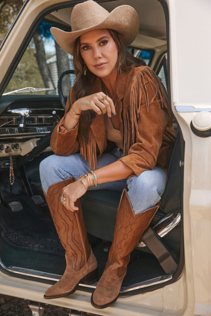 Kendra Scott wears the Abbie western boot