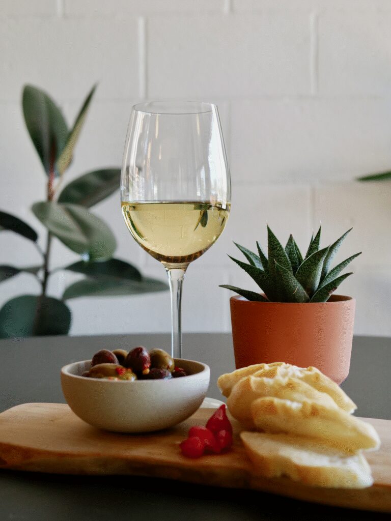 Baguette slices and Castelvetrano olives served at Flourish.