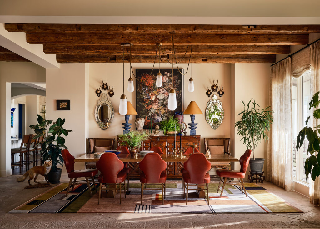 The formal dining room channels a Dutch still life with rich jewel tones