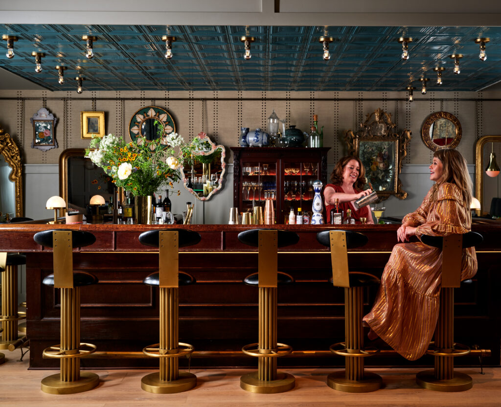 A custom speakeasy features a bar salvaged from a Ruth’s Chris Steak House.