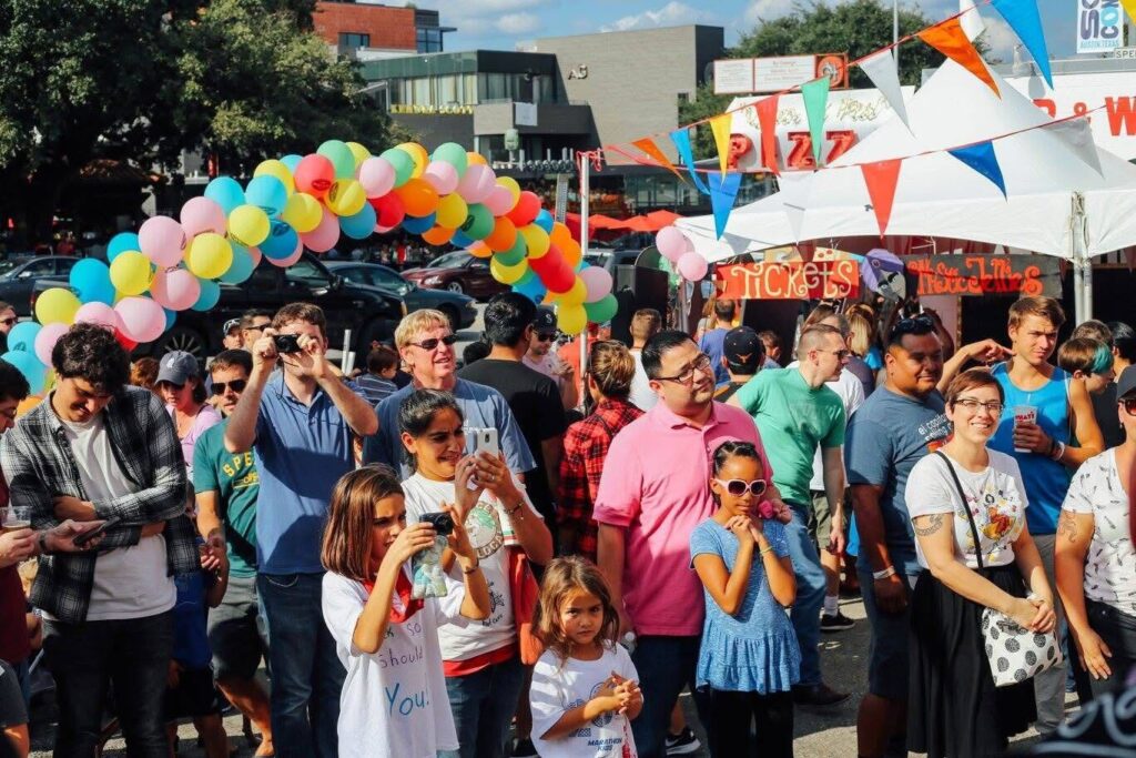 Guests enjoy games, music and pizza during Home Slice Pizza’s Carnival O’ Pizza in 2016.