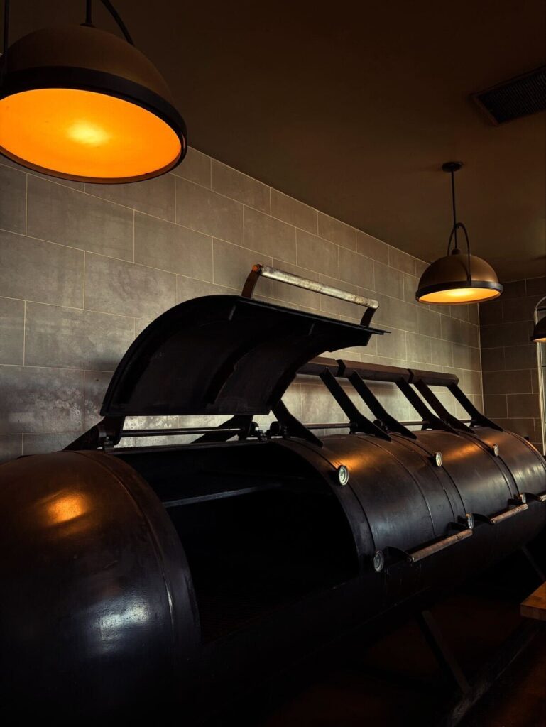 The restaurant's steel smoker used for slow-cooking meats. (Photo courtesy of Churchrow Tejas BBQ)