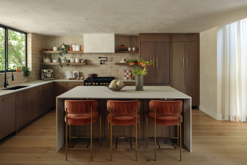 An elegant kitchen with a large island preps the home for hosting. (Photos by Chase Daniel) 