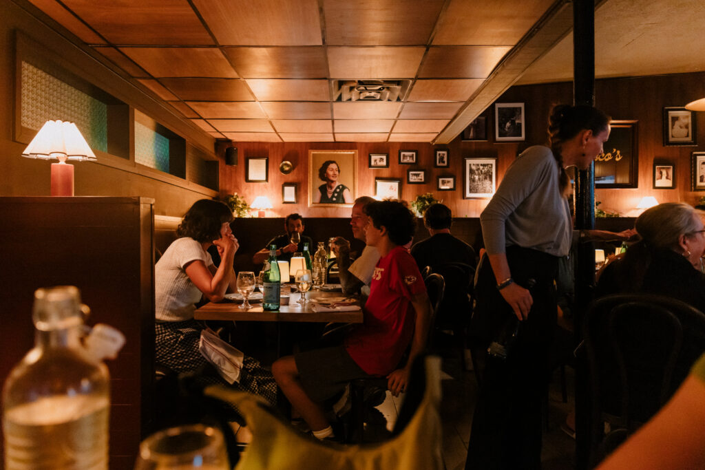 Guests dine at Rocco’s Neighborhood Joint, the new Italian restaurant on Airport Boulevard.  (Photo by Justin Cook)