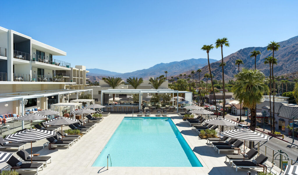 The pool at Thompson Palm Springs with mountain views.