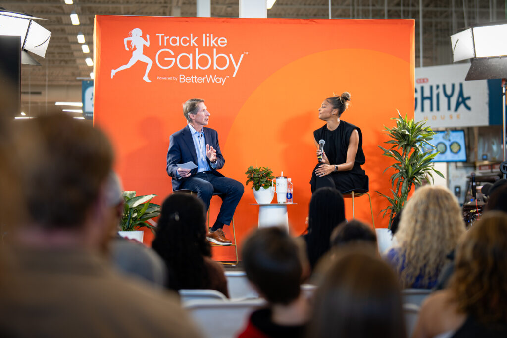 Gabby Thomas discusses the importance of routine blood testing at Live Well, Your Way Day at the South Congress H-E-B. (Photo courtesy of H-E-B)