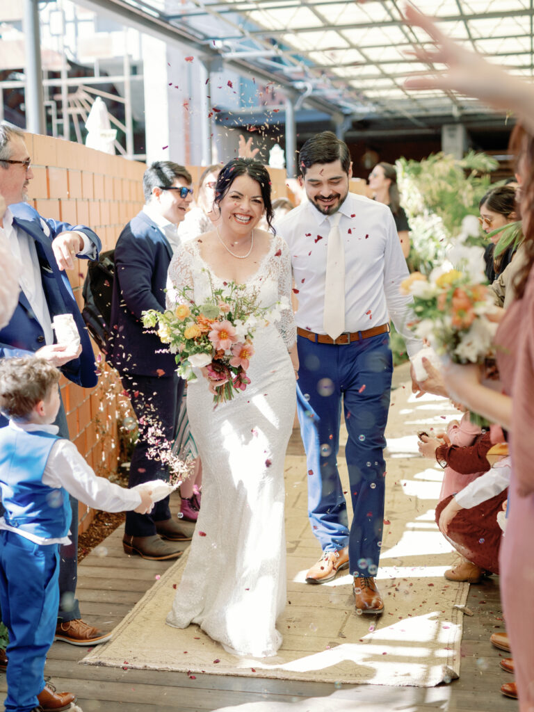 Jenna and Danny are married during a Free Love wedding event at Carpenter’s Hall in 2023. (Photo by Feather & Twine Photography)