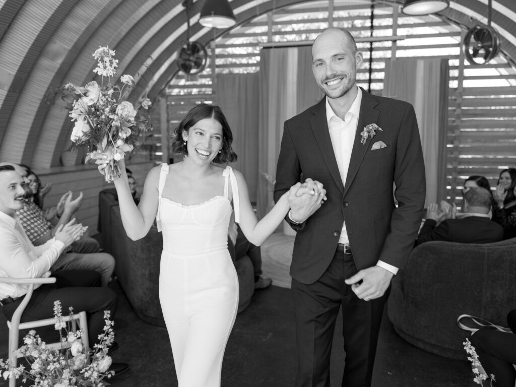 Jordyn and Jordan are married during a Free Love wedding event at Carpenter’s Hall in 2023. (Photo by Feather & Twine Photography)