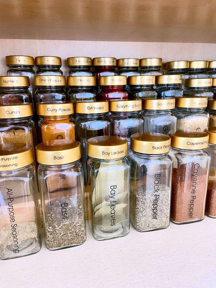 PaperCity-241574501097153-6431395174816425912-Decanted Spice Jars with Custom Labels by Settled In Soundly