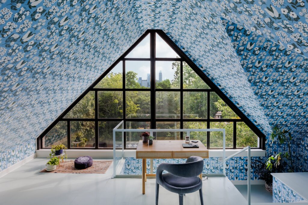 A second primary suite on the top floor of the Marlin House includes a custom steel-and-glass window with views of downtown Austin.