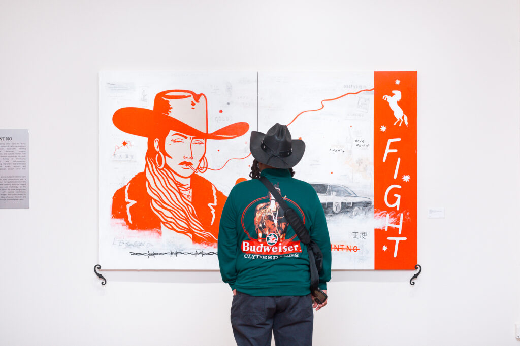 Guests view artwork during the “Beyond the West” public reception at West Chelsea Contemporary.