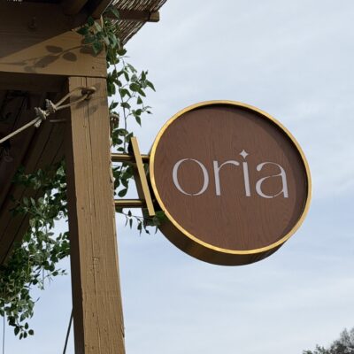 The exterior sign of Mediterranean restaurant Oria in Austin.