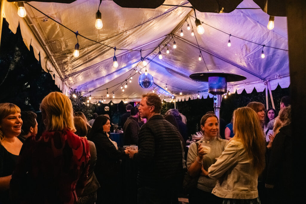 The crowd at Hotel Saint Cecilia in a tent on the patio for the "Party People" book launch.