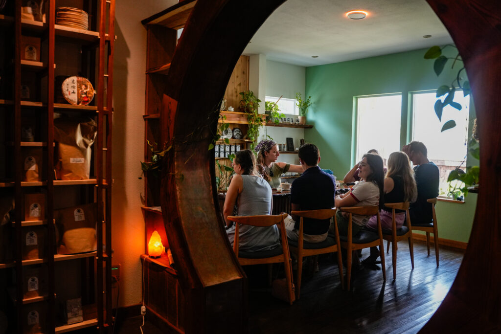 Tins and compressed tea discs line the shelves at West China Tea House in East Austin, where the teahouse stocks as many as 250 varieties sourced directly from small farmers in China.