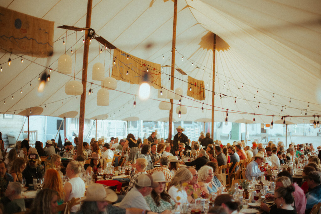 Guests gather for the annual Potluck dinner at Luck Ranch in Spicewood, Texas, in 2025, ahead of Luck Reunion. (Photo courtesy of Luck Presents)