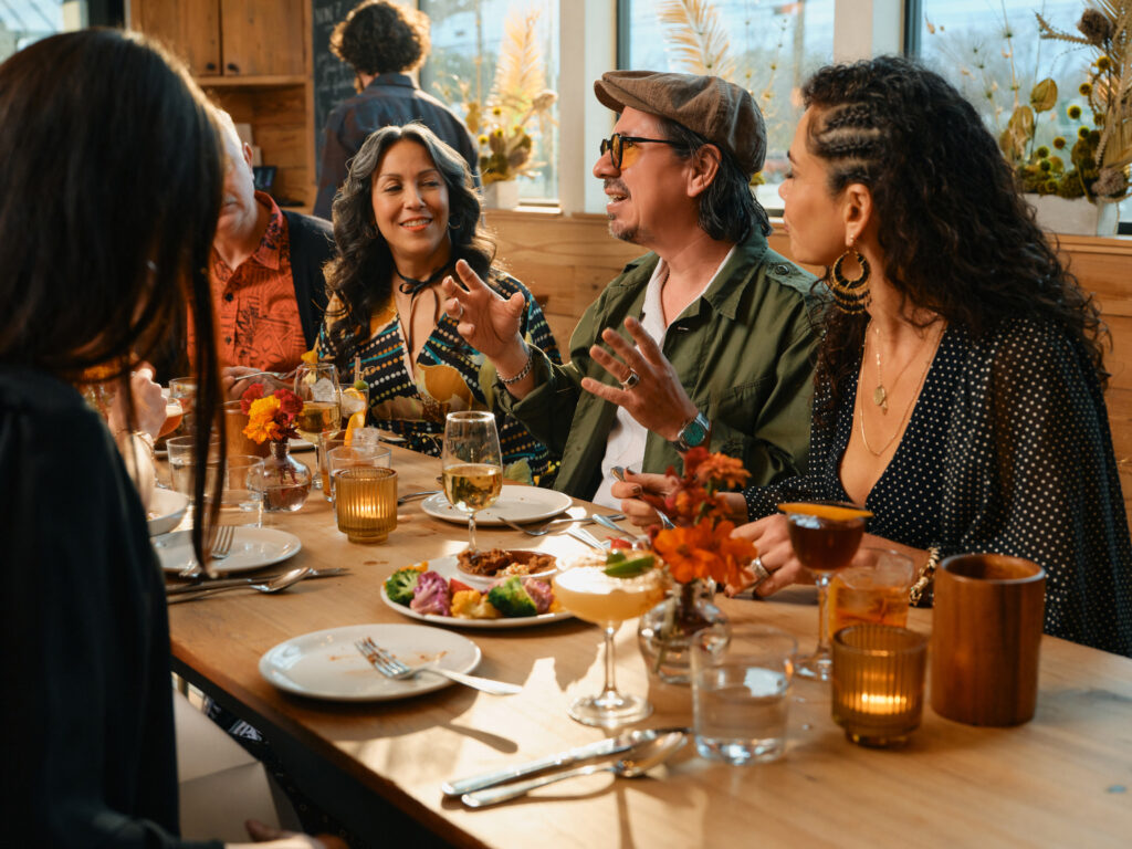 (From left) Graham Williams, Audrie San Miguel, Adrian Quesada and Celeste Quesada gather with their family at Bar Toti in Austin, Texas. (Photo by Cass Klepac)