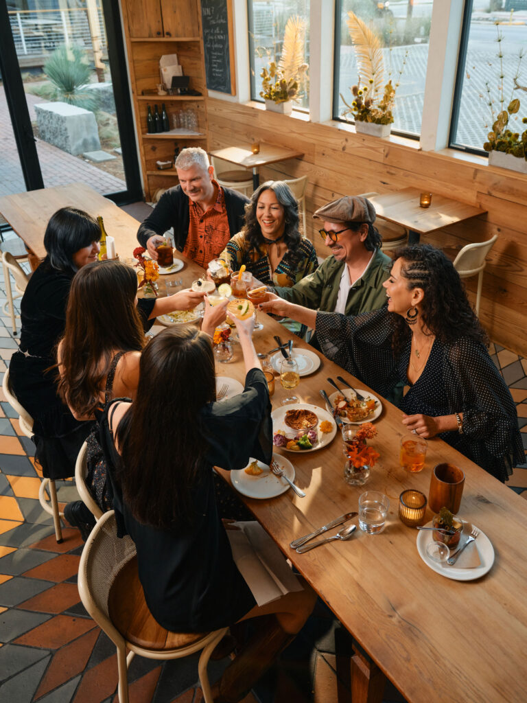 (From left) Graham Williams, Audrie San Miguel, Adrian Quesada and Celeste Quesada gather with their family at Bar Toti in Austin, Texas.