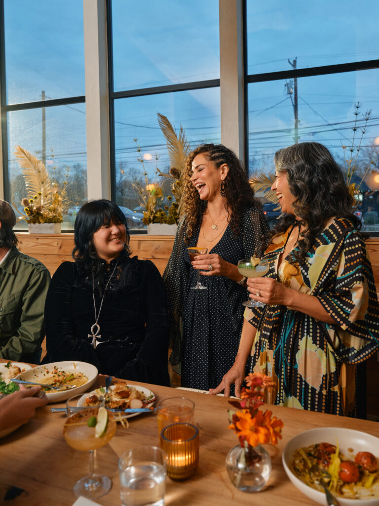 The family talks over dinner at Bar Toti. (Photo by Cass Klepac)