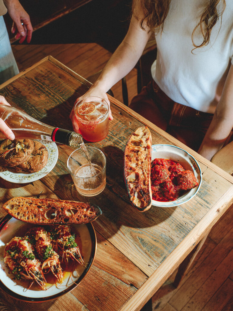 Boni’s small plates, including the Shrimp and Garlic with glass bread and Stewed Pork Meatballs.