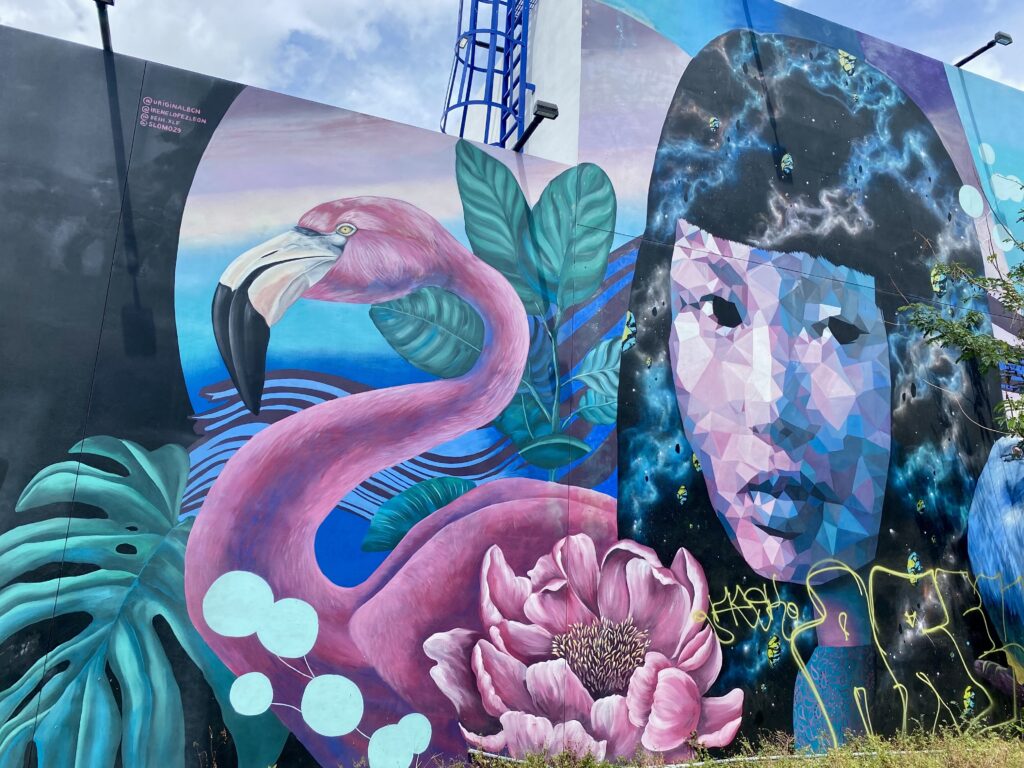 Mural with flamingo and woman at Wynwood Walls, Miami.