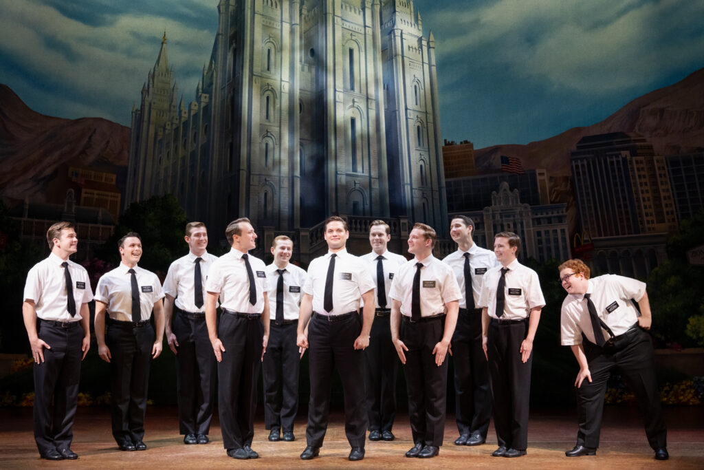 Sam McLellan and the company of the North American tour of "The Book of Mormon." (Photo by Julieta Cervantes)