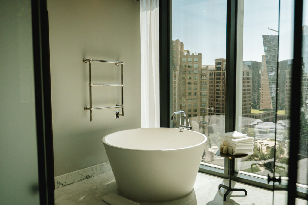 large round bathtub with Dallas city views