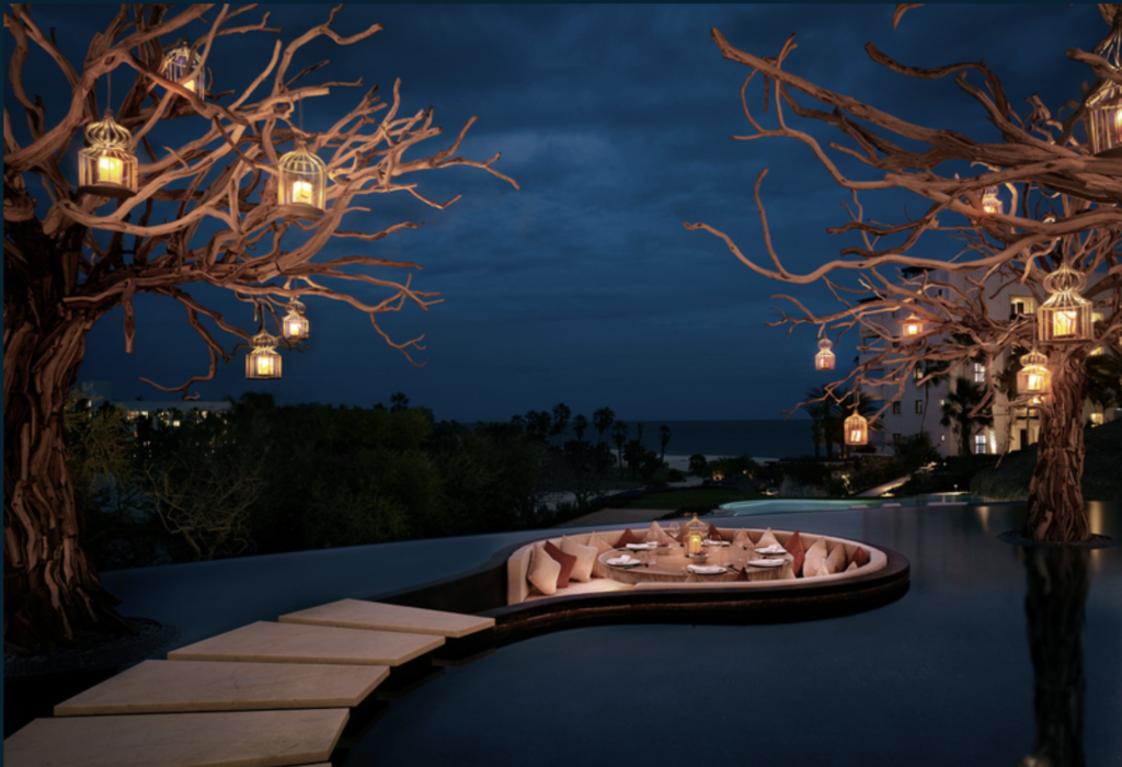 Arbol restaurant's sunken table surrounded by water at Las Ventanas al Paraiso, a Rosewood Resort