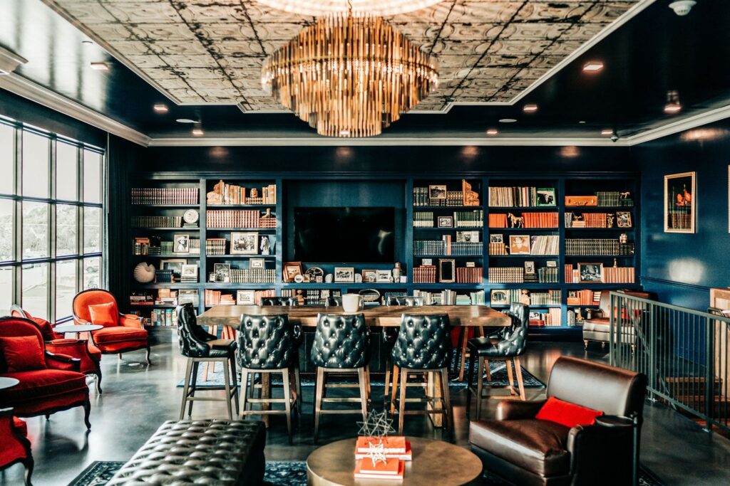 Simona’s Coffee + Cocktails’ upstairs lounge offers a moody, maximalist dark academia escape. (Photo courtesy of Simona’s).