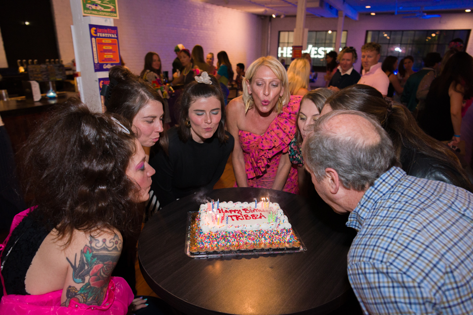 The TRIBEZA Team blows out birthday candles at Antone's.