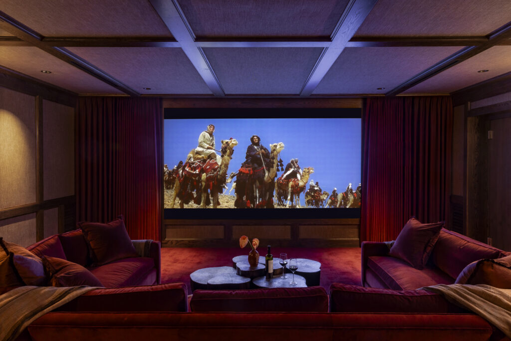 The home theater in a Tarrytown residence designed by Mark Cravotta of Cravotta Interiors was built within a concrete shell.