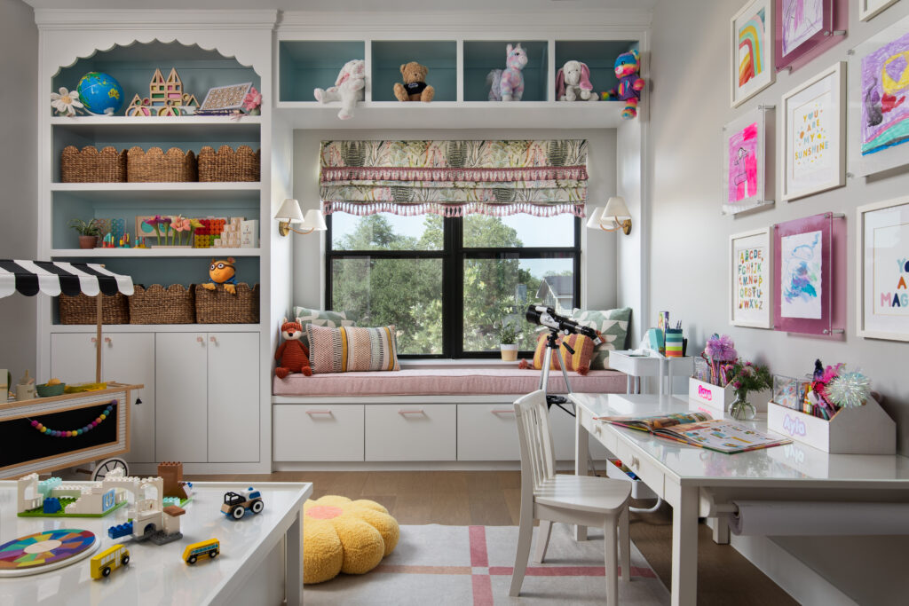 The custom-designed playroom in the Bamford Drive home features vibrant artwork, built-in storage and cozy spaces for creativity and play.