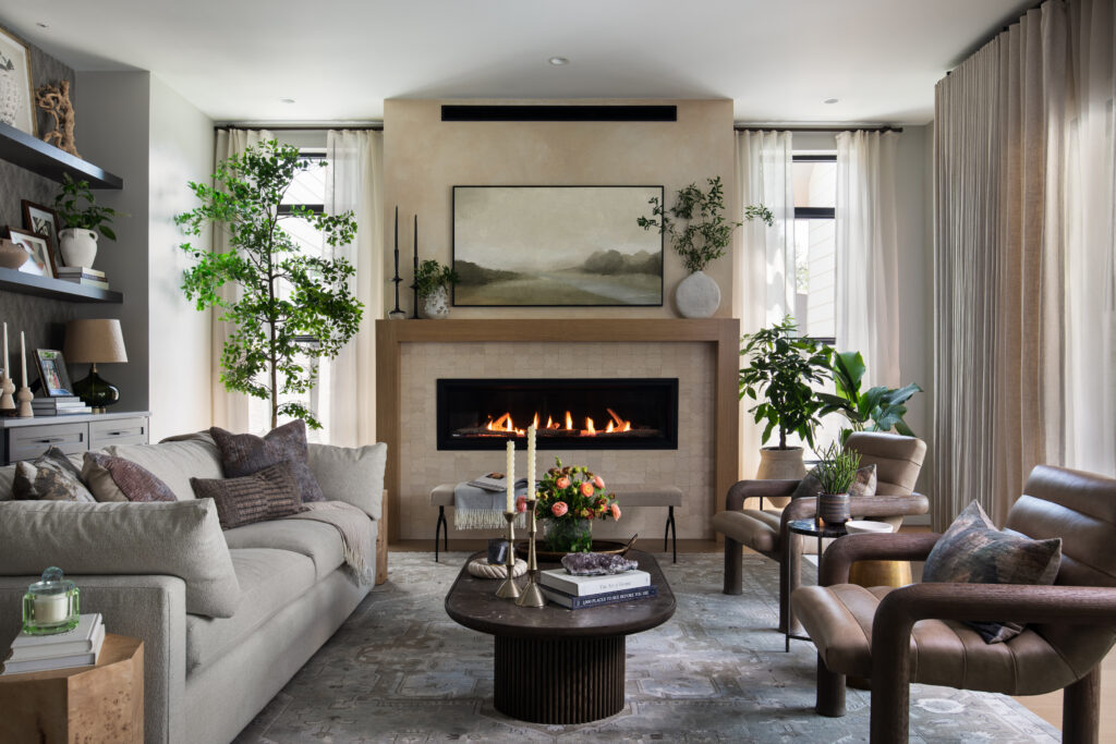 The living room of the Bamford Drive home features warm neutrals, layered textures and refined details selected by Komal Sheth of Spaces Designed.