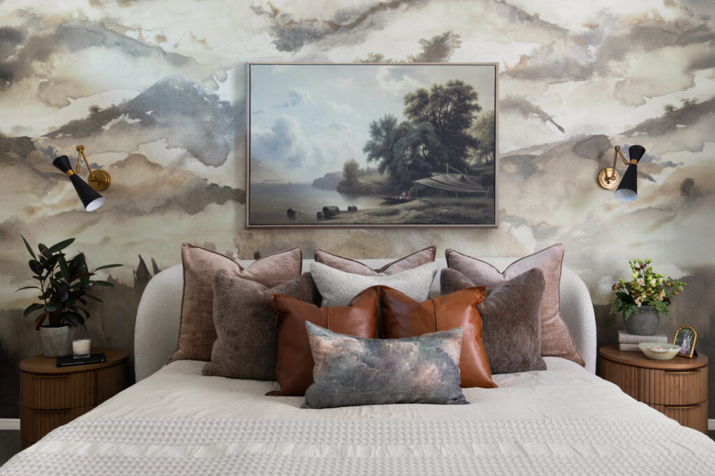 The primary bedroom in the Bamford Drive home pairs soft textures and warm neutral tones to create a calm, inviting retreat.