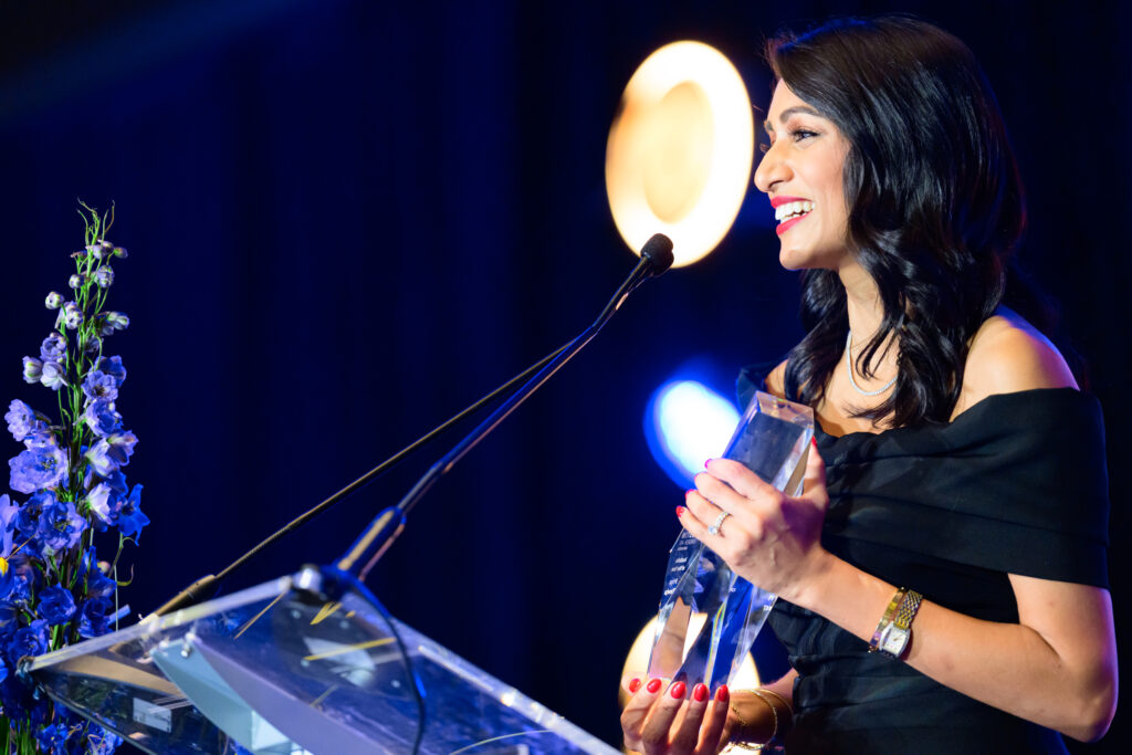 Priya Taneja receives the 2026 Austinite of the Year award during the Austin Under 40 Awards gala. (Photo by Dave Hawks Photography)
