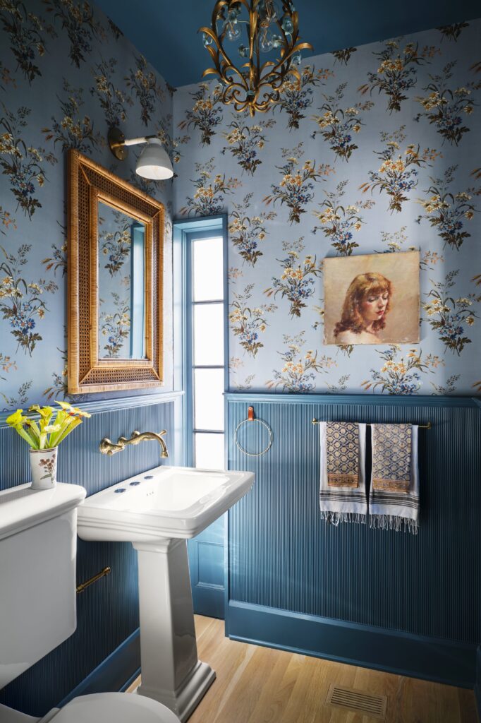The powder room in the Judges Hill home features rich color, playful pattern and carefully selected finishes that reflect the home's layered design aesthetic.