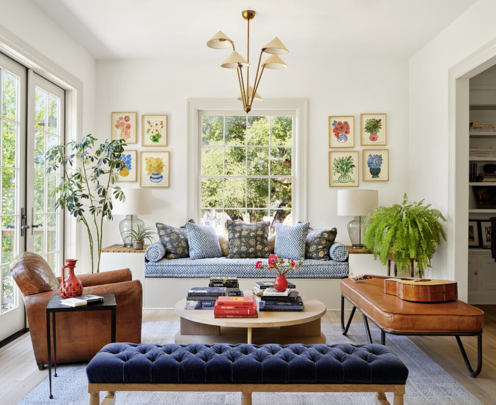 The sunroom of the Judges Hill home offers a bright, inviting space for reading and gathering.